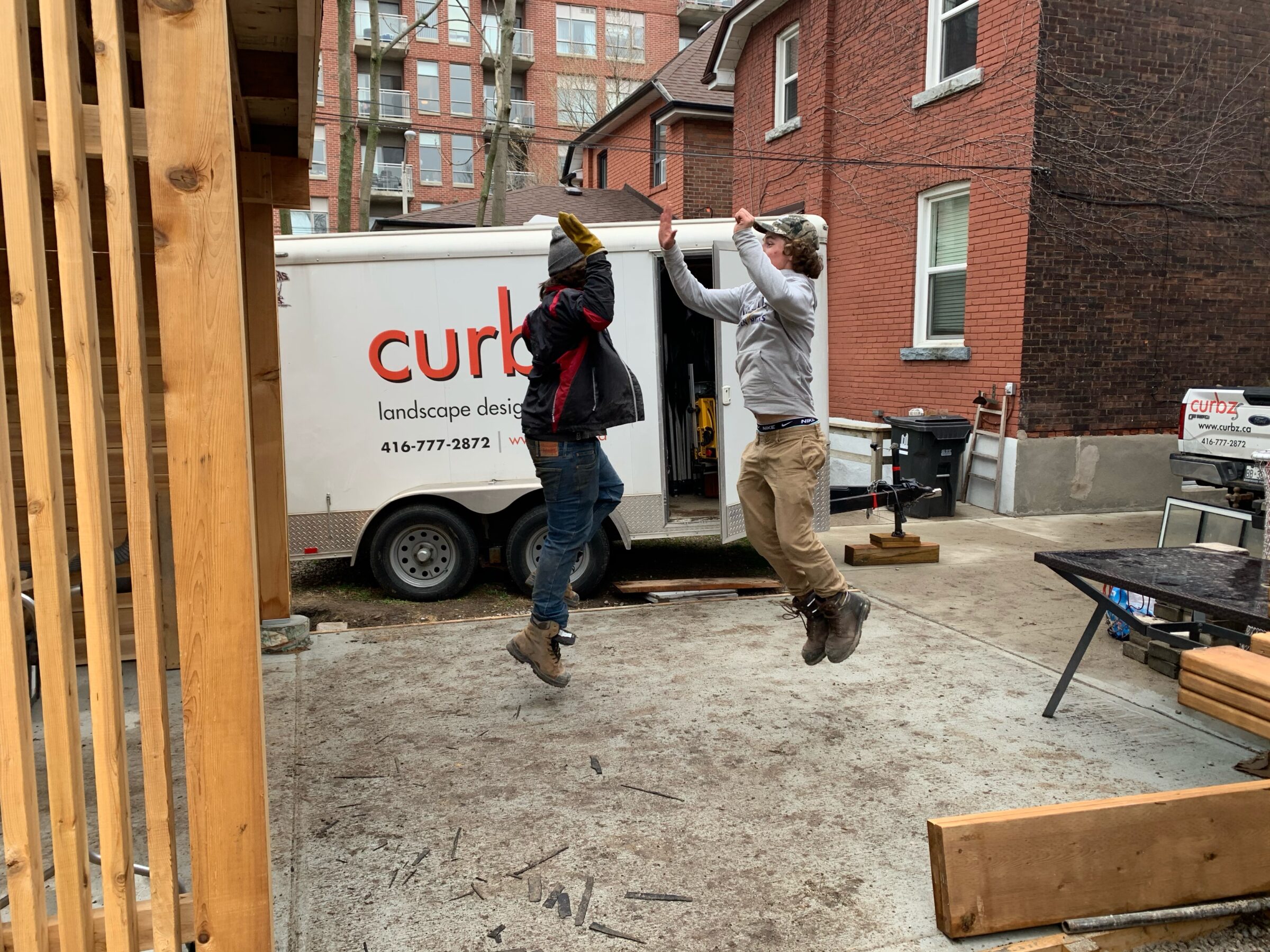 Two team members getting ready for a job with a client.