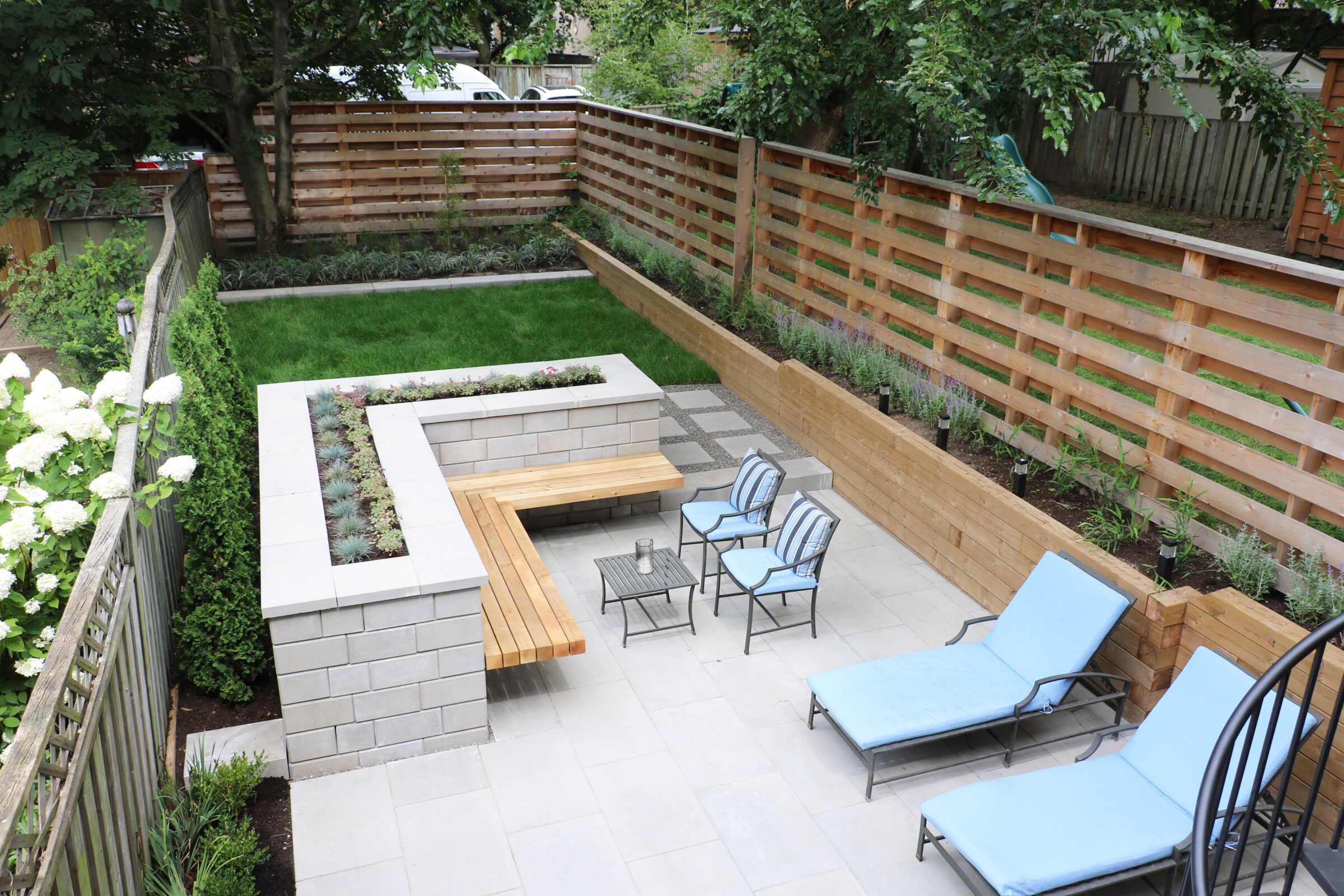 Stonework, fence, and outdoor living setup