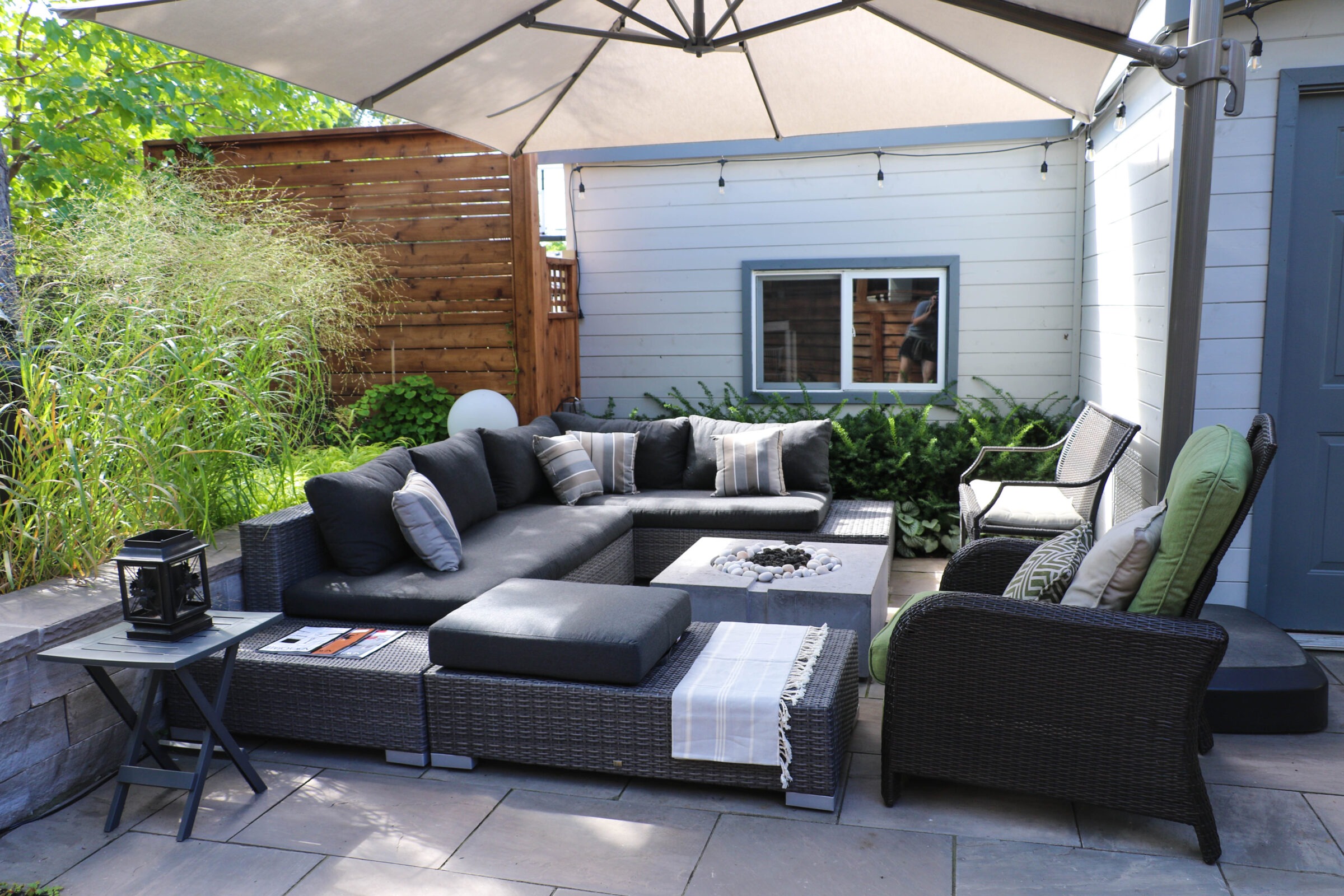 Outdoor sitting setup with a fire pit and shade